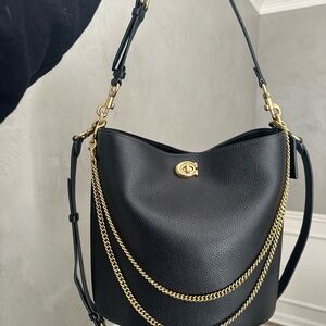 Elegant Black Leather Bucket Bag with Gold Accents